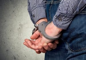 An image of someone in handcuffs after not abiding by the new 2019 Utah DUI Law