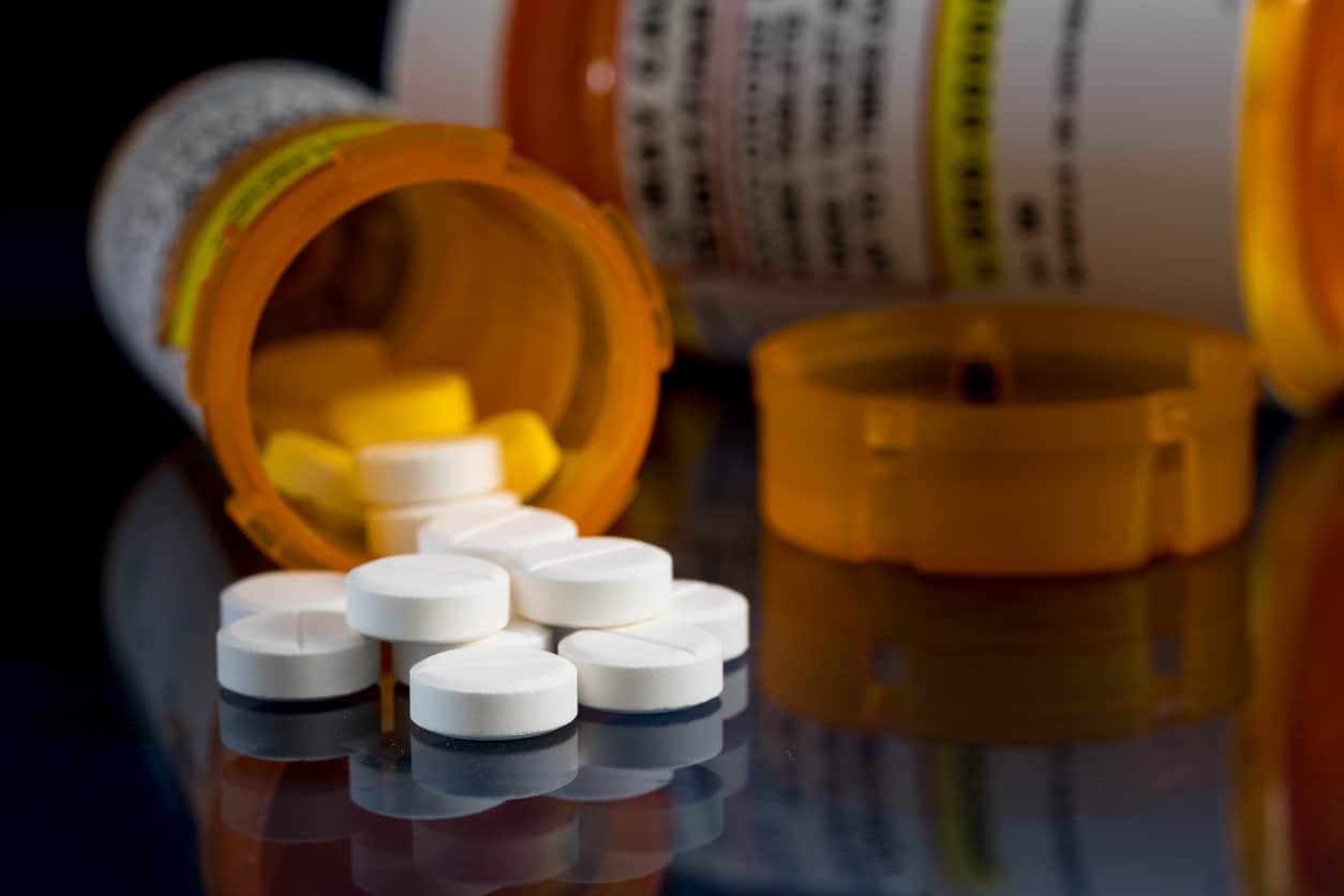 Oxycodone is the generic name for a range of opioid pain killing tablets susceptible for abuse of prescription medications. Prescription bottle for Oxycodone tablets and pills likely used for sharing medications and abuse of prescriptions drugs.